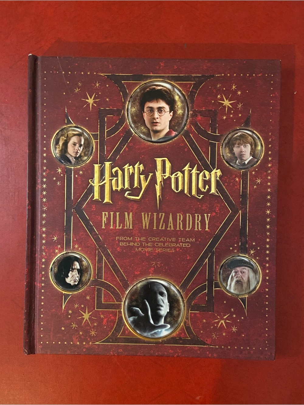 Warner Bros. Harry Potter Film Wizardry Hardcover Book - Red and Gold